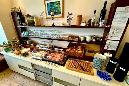 a counter with many food items on it at Pension Seeblick in Mörbisch am See