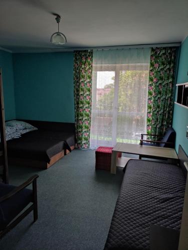 Postel nebo postele na pokoji v ubytování Korsarz