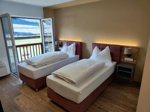 Voodi või voodid majutusasutuse Hostel Bad Goisern toas
