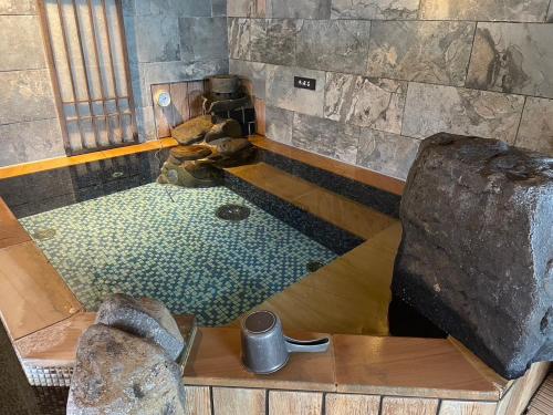 an overhead view of a bath tub in a room at Dormy Inn Kumamoto Natural Hot Spring in Kumamoto