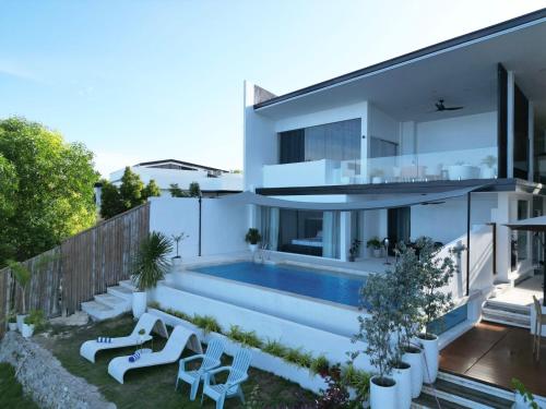 an image of a house with a swimming pool at Epic Suites Bohol ADULTS ONLY in Dauis