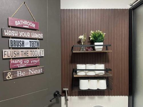 a bathroom with rolls of toilet paper on a wall at MaRoy Suites at Asteria Residences (Near NAIA with free Parking+Fiber Internet) in Manila