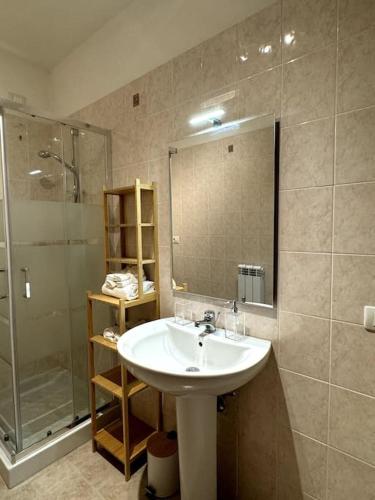 a bathroom with a sink and a shower at Fontana Apartment in Perugia