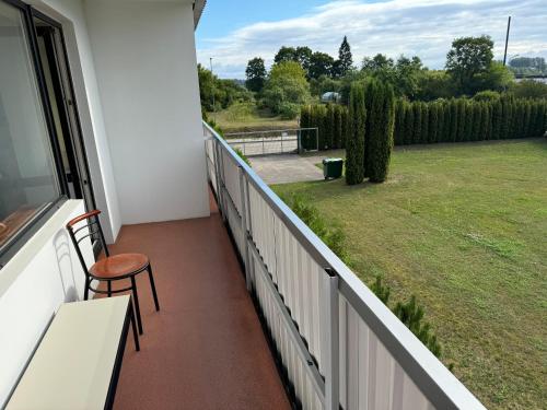 a balcony with a view of a yard at Baskervilu Muiža in Sērenes
