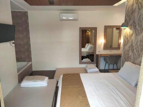 Postel nebo postele na pokoji v ubytování The BH project exclusive resorts San Juan, Batangas