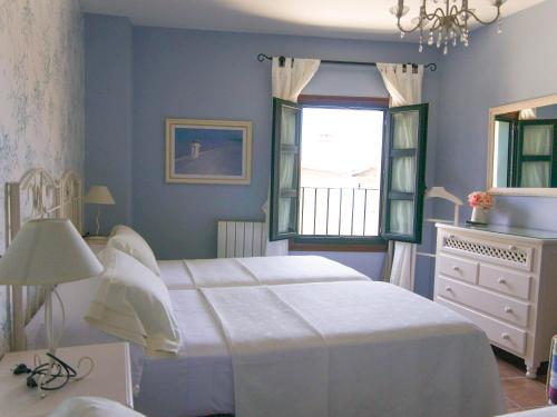 Ένα ή περισσότερα κρεβάτια σε δωμάτιο στο Casa Puertas