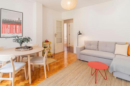a living room with a couch and a table at Casa Lima in Barroselas