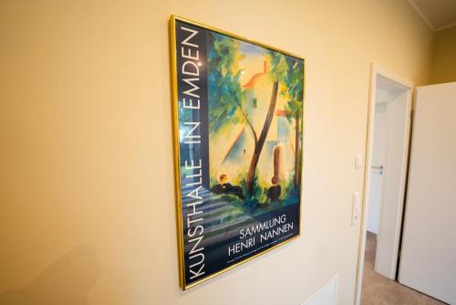 a painting hanging on a wall in a hallway at Klause am grünen Hof in Friesoythe