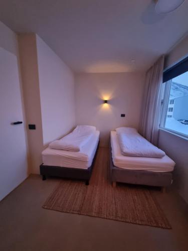 Dúfan Apartmentsにあるベッド
