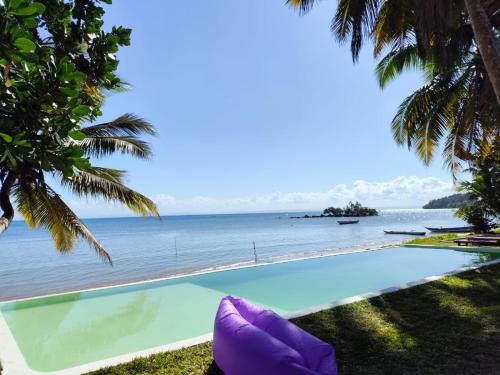 a view of the ocean from a resort pool at La Spiaggia, tropical villa with private beach in Sainte Marie