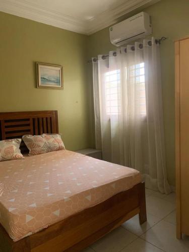 Postel nebo postele na pokoji v ubytování Residence Hadja 03