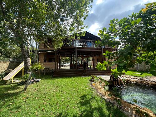a house with a pond in front of it at Casa do Lago em Alter do Chão in Alter do Chao