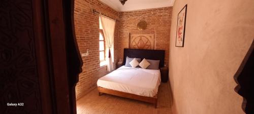 Postel nebo postele na pokoji v ubytování Riad maison Bounouar