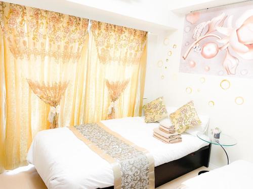 a bedroom with a bed and a window with curtains at 801 5mins from JR Kinshicho! Near Asakusa&Skytree! in Tokyo