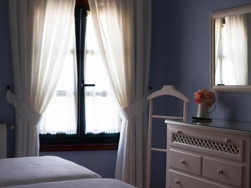A bed or beds in a room at Casa Puertas