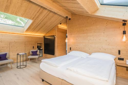 Hotel Bella Vista Zermattにあるベッド