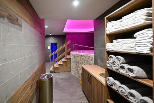 a room with stairs and a room with towels at Unique View Design Apartment Štrbské Pleso in Štrbské Pleso