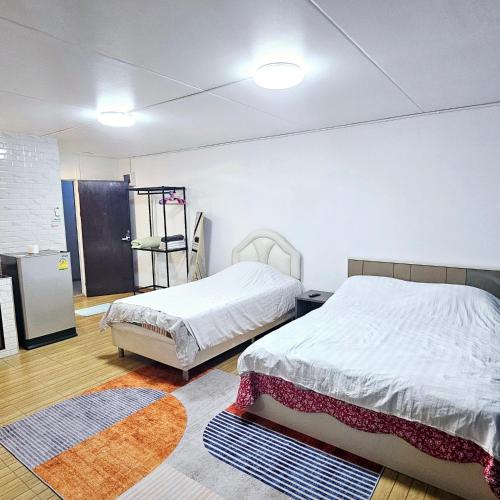 Letto o letti in una camera di อิมแพ็ค เมืองทองธานี ห้องเช่ารายวัน เมืองทอง popular condo C5