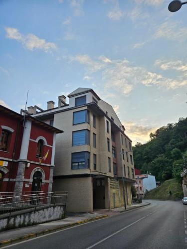 a building on the side of a street at La Casina Del Alce in Aller