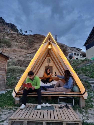 a group of people sitting in a tent at Driftters in Chakrāta