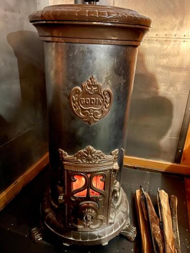 a large metal vase sitting on top of a table at Marmotte Mountain Manor in Chamonix-Mont-Blanc