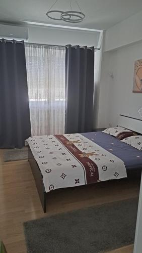 Postel nebo postele na pokoji v ubytování Apartment Moki