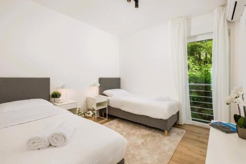 Ένα ή περισσότερα κρεβάτια σε δωμάτιο στο Bellevue Adria Residence