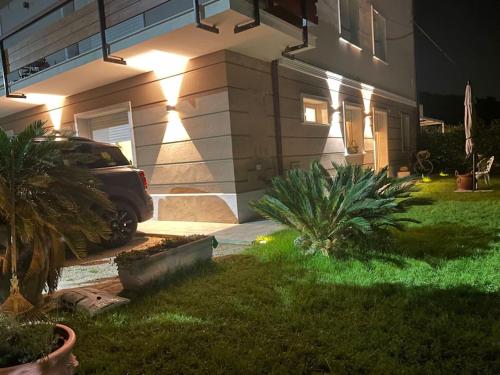a house with a car parked in the yard at night at Ca del Gno in Luni