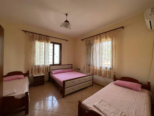 Llit o llits en una habitació de Fortunella Apartment