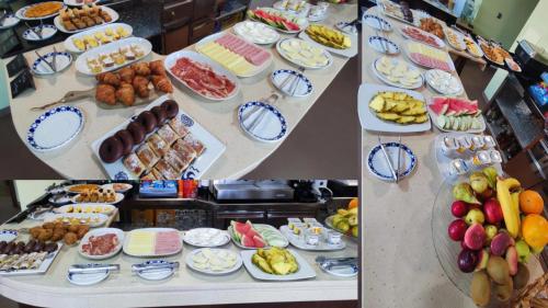 a buffet with many different types of food on display at Hotel A Bota in Sanxenxo