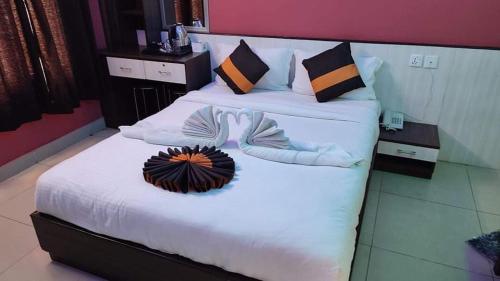 a hotel room with two beds with towels on them at Hotel Royal Inn Nuwakot in Trisūli Bāzār