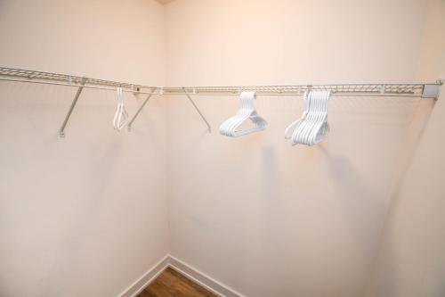 a bathroom with two lights on the wall at Golf Paradise Pool Fire Pit King Bed in Innisfil