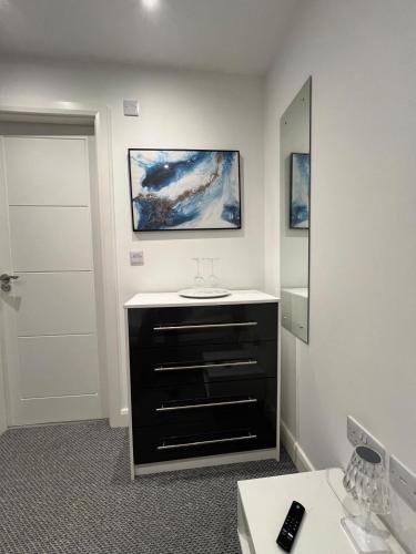 a bathroom with a sink and a mirror at Fully ensuite room in Hull