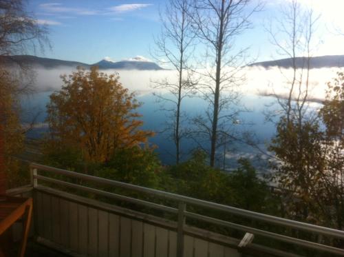 a view of a foggy valley from a balcony at Tärnaby Rooms & Apartments in Tärnaby