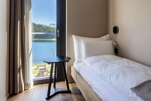 Katil atau katil-katil dalam bilik di Postresidenz am See