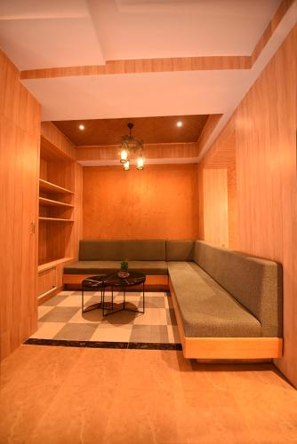 a living room with a couch and a table at Hotel Vistara in Kathmandu