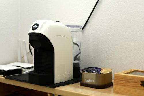 a coffee maker sitting on top of a desk at La Casetta di Eli in Siracusa