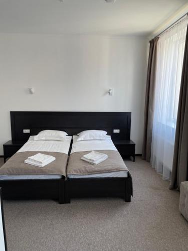 Postel nebo postele na pokoji v ubytování Leo Rooms