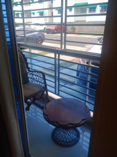 a window with a chair and a table on a balcony at Para Ti que desea Descansar en un lugar tranquilo in Mendoza