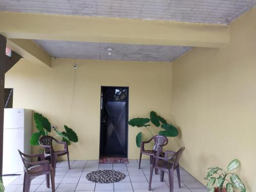 a room with chairs and a black door at D Quiet Spot Vacation Rental in Peñal
