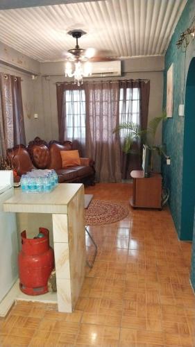 a living room with a couch and a table at D Quiet Spot Vacation Rental in Peñal