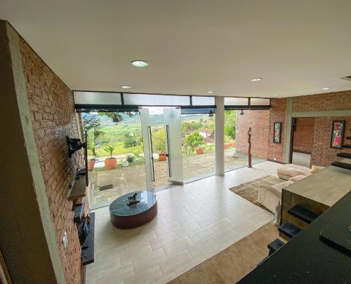 a living room with a couch and a fireplace at Lujosa finca en La Cumbre, Piscina, jacuzzi, WiFi, 5BR in La Cumbre