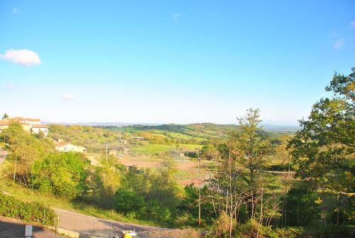 a view of a countryside with trees and a road at Le Casine di Tuscany Maremma Saturnia in Catabbio