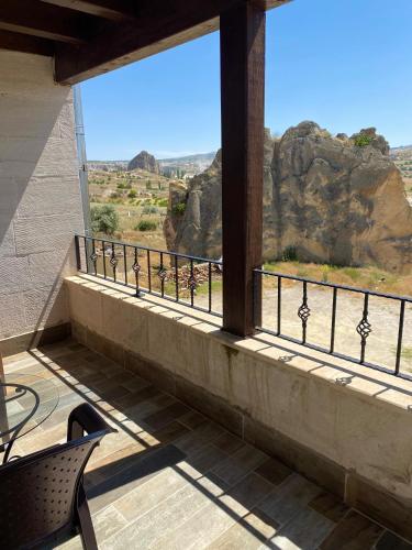 a balcony with a view of the canyon at Mesken Cave Suites in Nevsehir