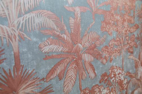 a wall with a painting of plants on it at Georgian House Hotel in Whitehaven