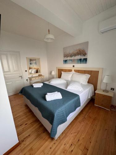Postel nebo postele na pokoji v ubytování Anemos Apartment