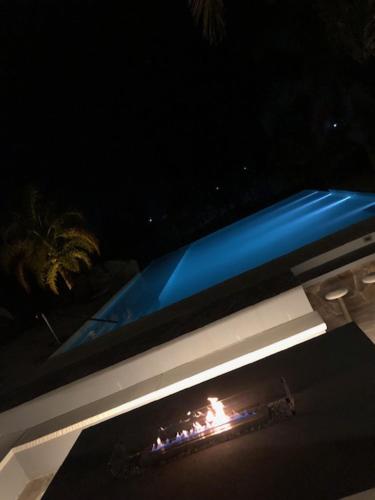 a view of a pool at night at Noha Casa de Campo in Colón