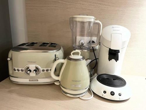 a blender and a toaster sitting on a counter at Côté Mer Wonderfull 2 bedrooms beachfront Nettle bay Beach Club in Baie Nettle