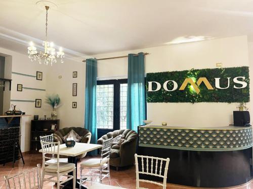 a dining room with a sign on the wall at Agriturismo Domus Tuscia in Viterbo