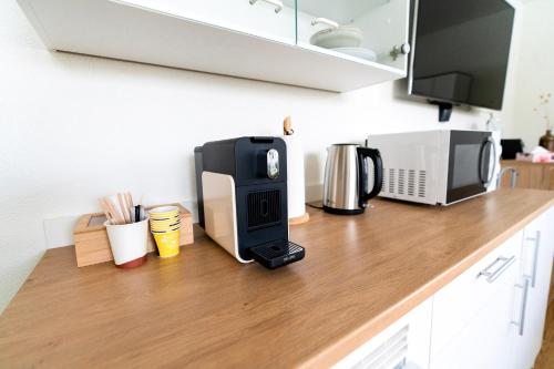 Una cocina o cocineta en Cozy Studio Einigen